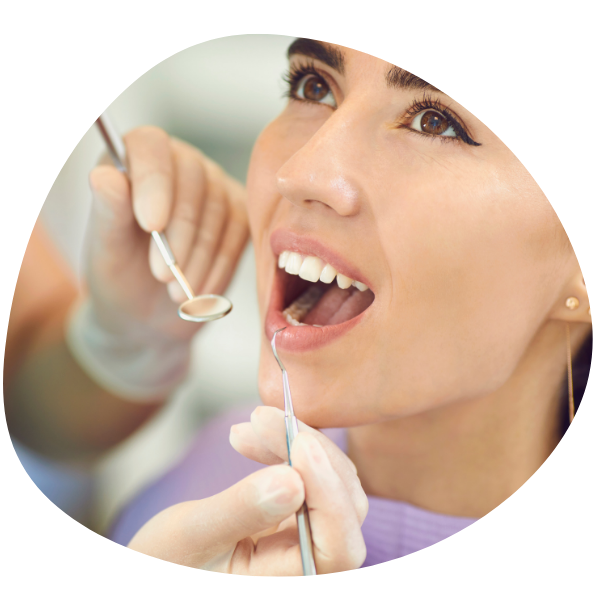 Woman getting dental exam.
